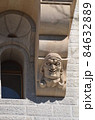 Gargoyle grimaces as building decoration 84632889