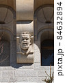 Gargoyle grimaces as building decoration 84632894