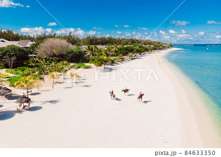 Luxury tropical beach in Mauritius. Beach with palms and blue ocean. Aerial view 84633350