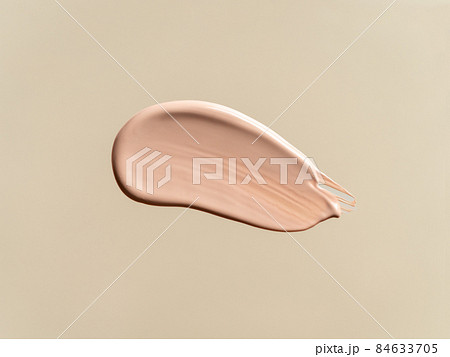 Liquid foundation on nude beige background Liquid foundation on nude beige background 84633705