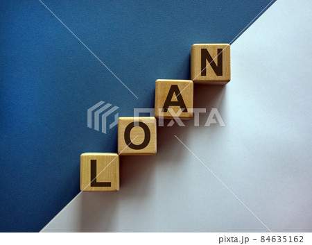 Wood block with word 'loan' stacking as step stair on paper blue and white background, copy space. Business concept success process. 84635162