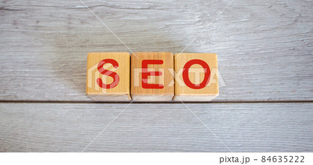 Concept word seo on cubes on a beautiful white wooden table. Concept word seo on cubes on a beautiful white wooden table. 84635222