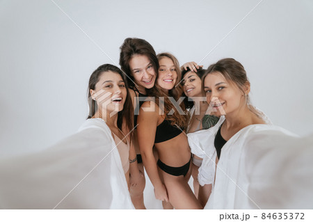 Diverse models wearing comfortable underwear take selfie 84635372