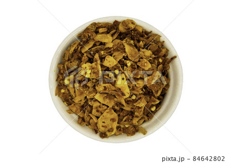 Dried chilli paste with crispy shrimp thai style or Crispy shrimp chilli paste in ceramic white cup isolated on white background. Dried chilli paste with crispy shrimp thai style or Crispy shrimp chilli paste in ceramic white cup isolated on white background. 84642802