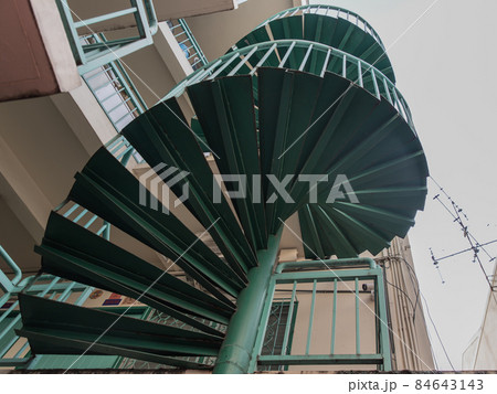 Green spiral staircase pattern view from below. 84643143