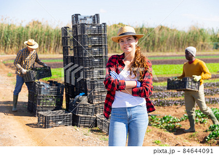 Portrait of woman farmer standing at the farm field 84644091