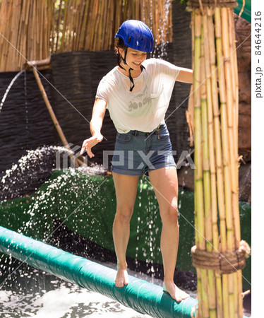 Girl passing horizontal bar with obstacles Girl passing horizontal bar with obstacles 84644216