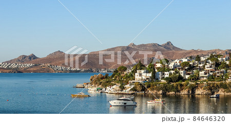 Blue sea, boats, mountains and islands on the Aegean coast. Summer vacation and coastal nature concept Blue sea, boats, mountains and islands on the Aegean coast. Summer vacation and coastal nature concept 84646320