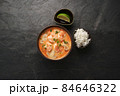 Tom Yam kung Spicy Thai soup with shrimp, seafood, coconut milk and chili pepper in bowl  84646322