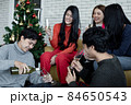 Party of group young Asian with pour wine for drink at home in celebrate Christmas festival. 84650543