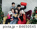 Selfie of group young Asian with gifts at home in celebrating Christmas festival. 84650545