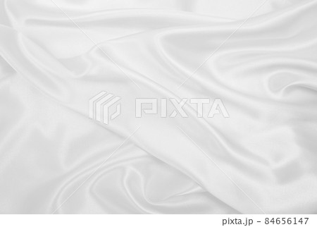 Smooth elegant white silk or satin luxury cloth texture as wedding background. Luxurious background design 84656147