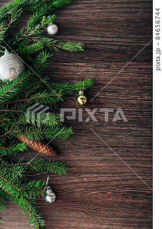 Christmas Tree Branches on a Brown Background with CopySpace for Text Christmas Tree Branches on a Brown Background with CopySpace for Text 84656744