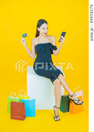 Portrait beautiful young asian woman smile with shopping bag Portrait beautiful young asian woman smile with shopping bag 84658279