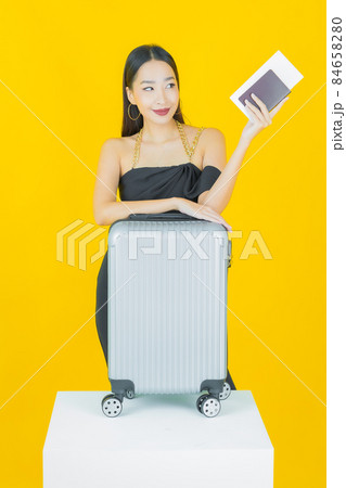 Portrait beautiful young asian woman with luggage bag and passport 84658280