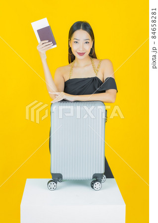 Portrait beautiful young asian woman with luggage bag and passport 84658281