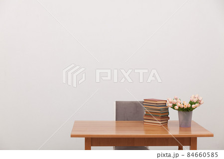 desk with flowers and books for learning 84660585