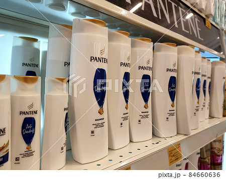 SELANGOR, MALAYSIA -JUNE 9, 2020: Selected focused on the hair shampoo in plastic bottle packaging, on display for sale on the shelves in the supermarket. Tagged with the price tag. 84660636