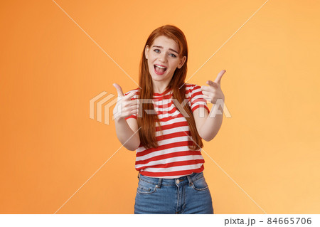 Lucky cool redhead sassy girl singing pointing camera, talking about you, congratulate friend good job, impressed coworker effort, stand orange background boastful, wear summer striped t-shirt Lucky cool redhead sassy girl singing pointing camera, talking about you, congratulate friend good job, impressed coworker effort, stand orange background boastful, wear summer striped t-shirt 84665706