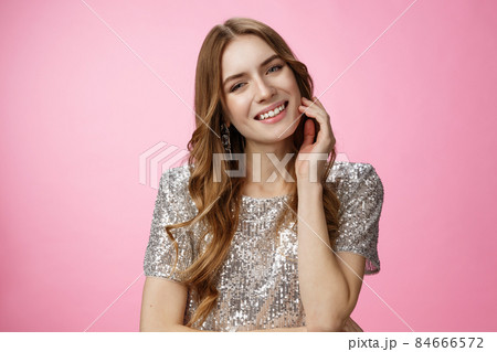 Adorable flirty carefree tender caucasian female touching face playfully tilting head smiling sensually seducing gazing you slight silly grin, standing pink background coquettish Adorable flirty carefree tender caucasian female touching face playfully tilting head smiling sensually seducing gazing you slight silly grin, standing pink background coquettish 84666572