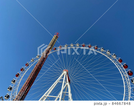 Ferris wheel on clear blue sky background Ferris wheel on clear blue sky background 84667848