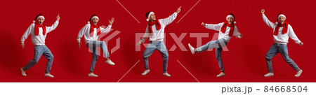 Set Of Joyful Young Man In Santa Hat Dancing Over Red Background Set Of Joyful Young Man In Santa Hat Dancing Over Red Background 84668504