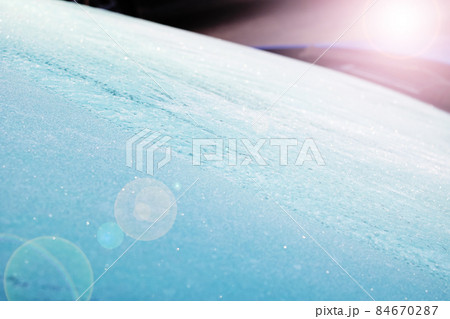 Ice bloom on blue surface of car Ice bloom on blue surface of car 84670287