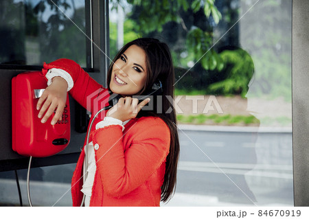 beautiful oriental business woman talking on street phone beautiful oriental business woman talking on street phone 84670919