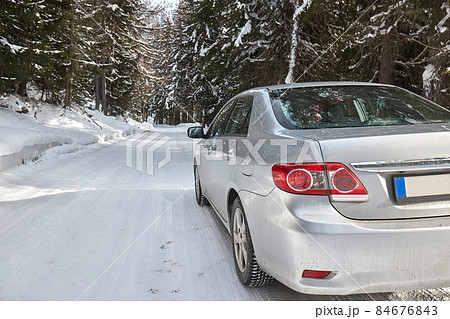 Winter driving on snow in mountains 84676843
