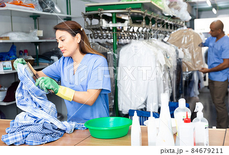Portrait of female laundry worker during daily work Portrait of female laundry worker during daily work 84679211