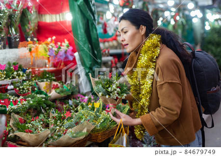 Asian woman at christmas fair 84679749