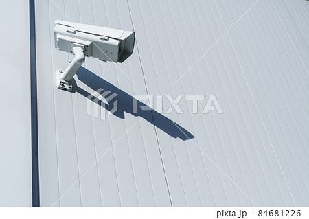 CCTV camera on the wall of the building for monitoring and protection. CCTV camera on the wall of the building for monitoring and protection. 84681226