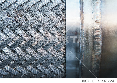 Metal texture with a herringbone pattern of steel. Metal texture with a herringbone pattern of steel. 84681228