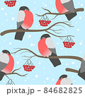winter seamless pattern with bullfinches on the branches with berries of rowanberry 84682825