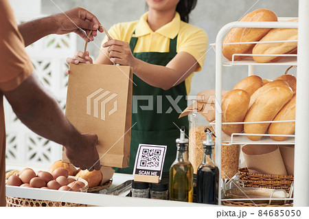 Bakery Worker Giving Package to Courier Bakery Worker Giving Package to Courier 84685050