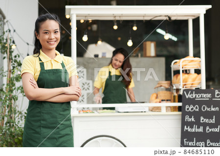 Smiling Young Street Vendor Smiling Young Street Vendor 84685110
