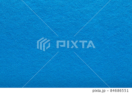 Fine grain blue woolen felt. Texture background. Velvet scarlet matte background of suede fabric 84686551