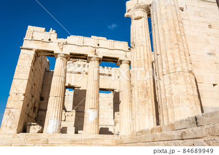 Ruined columns of the Propylaea monumental gateway to the Acropolis of Athens in Greece. Ruined columns of the Propylaea monumental gateway to the Acropolis of Athens in Greece. 84689949