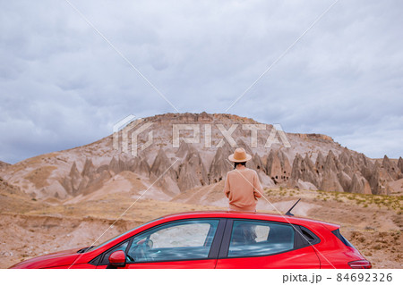 Happy woman on summer vacation in famous place. Cave formations. 84692326