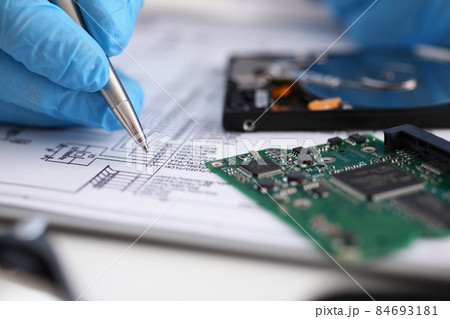 Male fill information in papers with silver pen wearing gloves 84693181