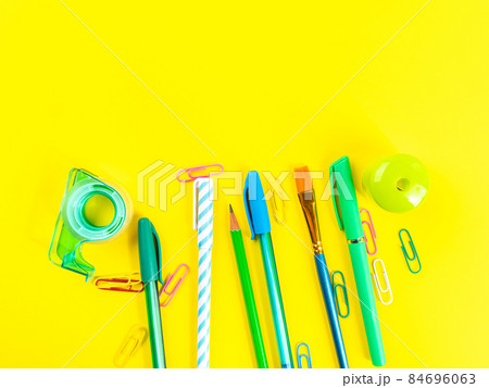 Back to school concept. Colorful office stationery on yellow background 84696063