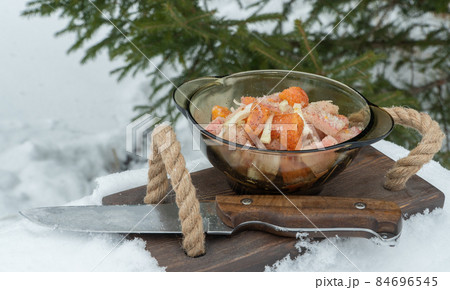 delicious dish of frozen fish. plate of food on the background of a Christmas tree. delicious dish of frozen fish. plate of food on the background of a Christmas tree. 84696545