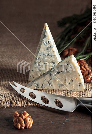 Blue cheese with walnuts and rosemary. Blue cheese with walnuts and rosemary. 84696994