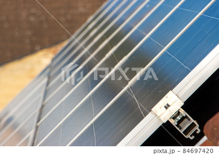 Solar panels on the roof of a house in the city. 84697420