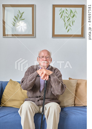 Elderly man resting on sofa 84697581