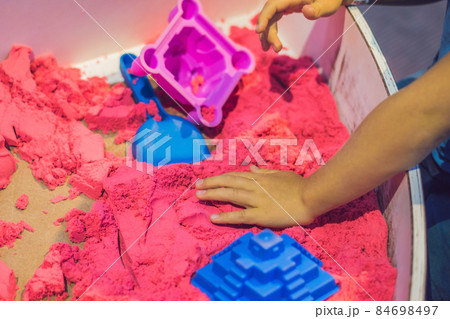 Boy playing with kinetic sand in preschool. The development of fine motor concept. Creativity Game concept 84698497
