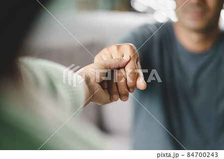 Female friend or family sitting and hold hands during cheer up to mental depress man, Psychologist provides mental aid to patient. PTSD Mental health concept Female friend or family sitting and hold hands during cheer up to mental depress man, Psychologist provides mental aid to patient. PTSD Mental health concept 84700243