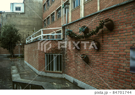 Wall of the Museum of Decorative and Applied Arts, decorated with clay jugs and garlands, in the courtyard of the Church of St. Mary in Tehran Wall of the Museum of Decorative and Applied Arts, decorated with clay jugs and garlands, in the courtyard of the Church of St. Mary in Tehran 84701744