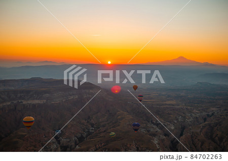 Bright hot air balloons in sky of Cappadocia, Turkey Bright hot air balloons in sky of Cappadocia, Turkey 84702263