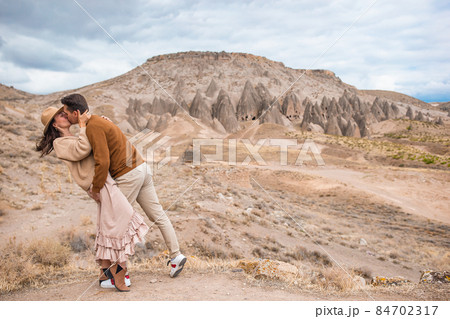 Happy couple on summer vacation in famous place. Cave formations. 84702317